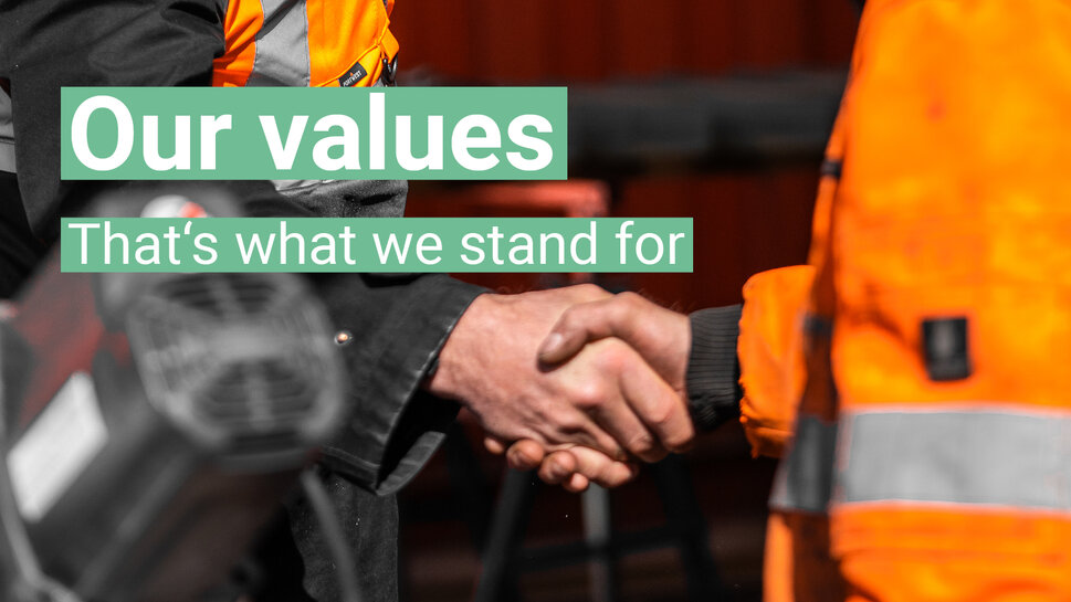 Our values - in the background two people shake hands