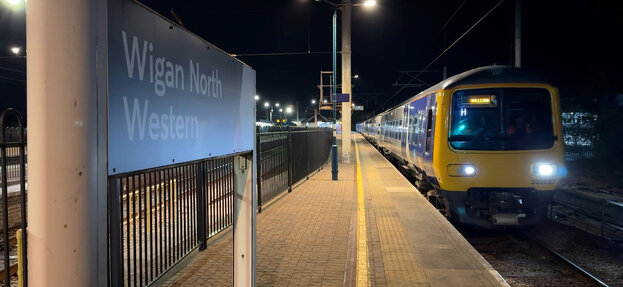 [Translate to English:] First shot of an electric train leaving Wigan Station